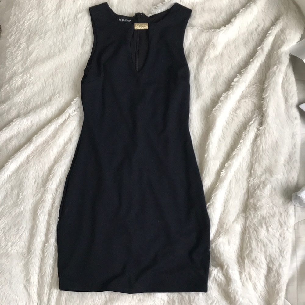 Black bebe dress. plunging neckline with gold. XXS